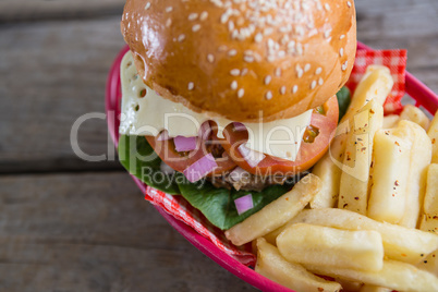 High angle view of cheeseburger with French fries
