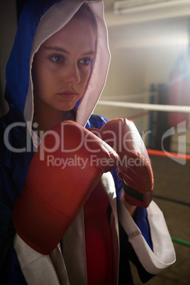 Woman practicing boxing in fitness studio