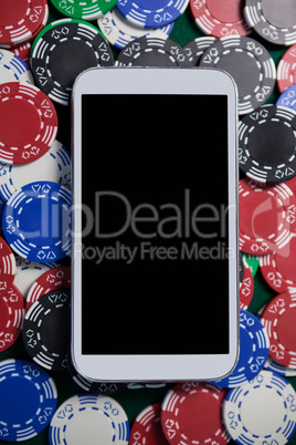 Mobile phone on multicolored casino chips