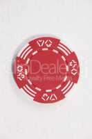 Red casino chip on white background