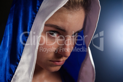 Determined woman wearing boxing robe