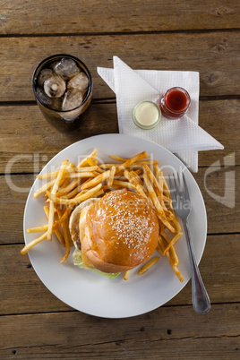 Snacks and cold drink on wooden table
