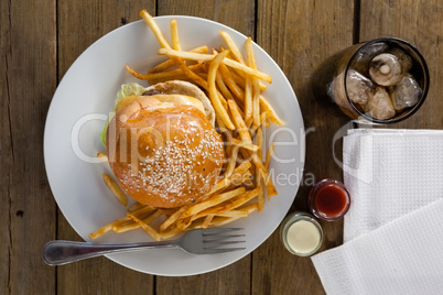 Snacks and cold drink on wooden table