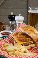 Burger and french fries in wicker basket