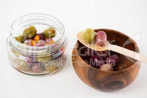 Marinated olives in bowl and jar