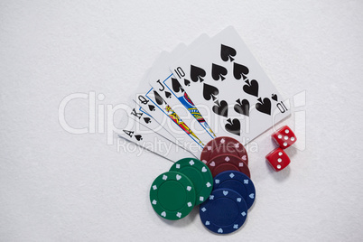 Playing cards, dice and casino chips on white background