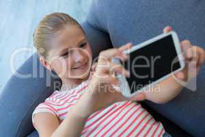 High angle view of girl taking selfie