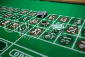 High angle view of ring and chips on roulette table
