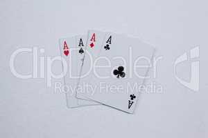 Playing cards arranged on white background
