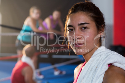 Close-up portrait of female athlete with towel