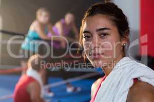 Close-up portrait of female athlete with towel