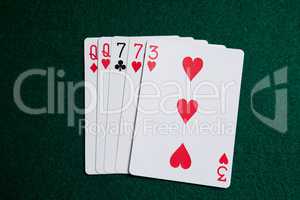 Playing cards arranged on poker table