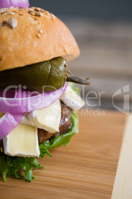 Cropped image of burger on cutting board