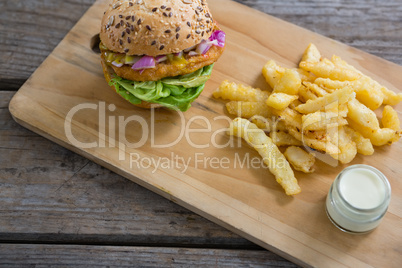 High angle view of burger and french fries with dip