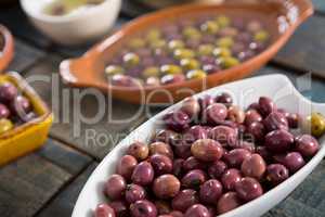 Marinated olives in white bowl