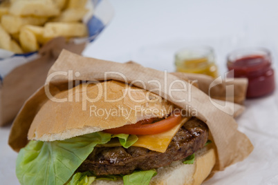 Close-up of hamburger in paper bag