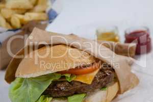 Close-up of hamburger in paper bag