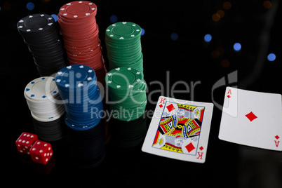 High angle view of cards and chips with dices
