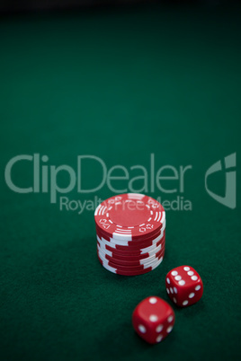 Pairs of dice and casino chips on poker table