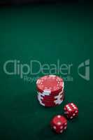 Pairs of dice and casino chips on poker table