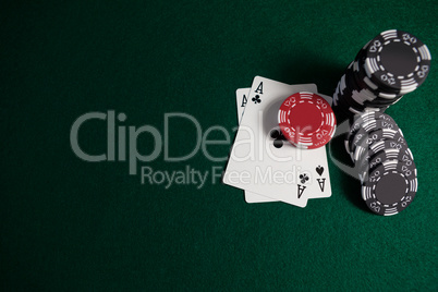 Playing cards and casino chips on poker table