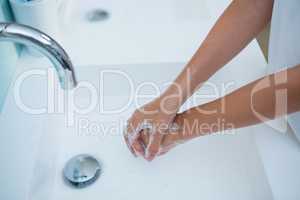 High angle view of girl washing hands