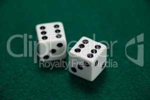 Pair of dice on poker table