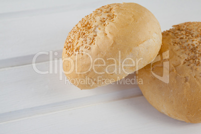 Two buns on wooden table