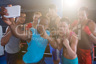 Young boxers taking selfie in fighting stance