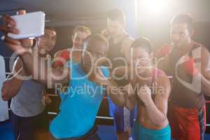 Young boxers taking selfie in fighting stance