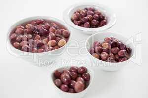 Close-up of pickled olives in bowls