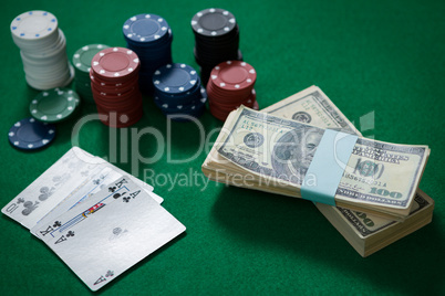 High angle view of cash with chips and cards