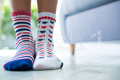 Low section of girl wearing patterned socks