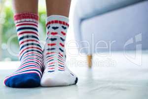 Low section of girl wearing patterned socks