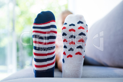 Close up of girl wearing different socks