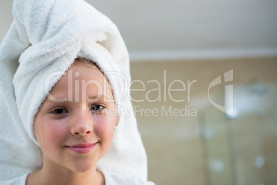 Portrait of girl with hair wrapped in towel