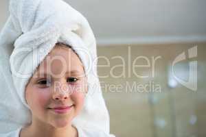 Portrait of girl with hair wrapped in towel