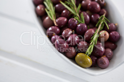 Olives garnished with rosemary