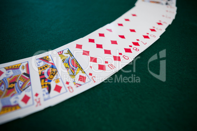 Playing cards arranged on poker table