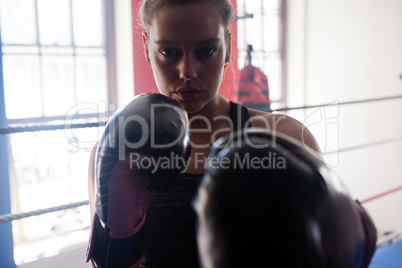 Portrait of confident woman practicing boxing