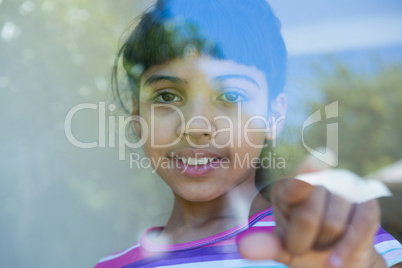 Close up of girl touching glass Close up of girl touching glass