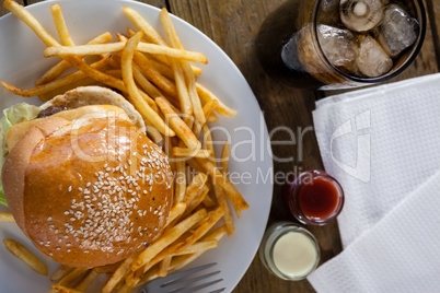 Snacks and cold drink on wooden table