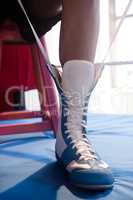 Boxer wearing shoes in boxing ring