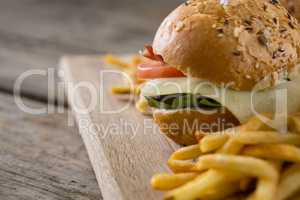 Close up of cheeseburger with french fries