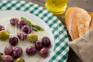 Marinated olives with oil and bread
