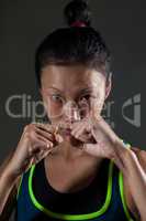 Determined woman practicing boxing in fitness studio