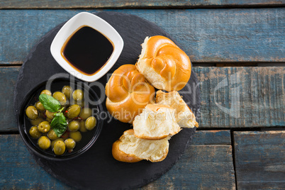 Marinated olives with bread pieces and olive oil