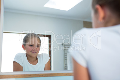 Girl looking in mirror