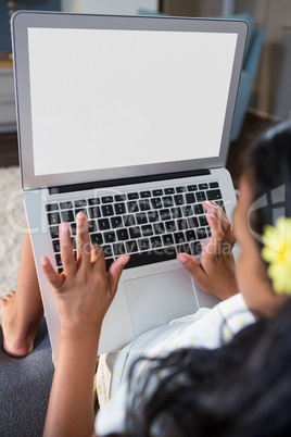 Close up of girl using laptop