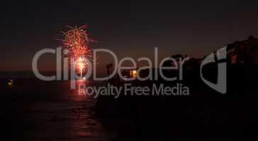 Colorful explosion of fireworks over the Emerald Bay beach
